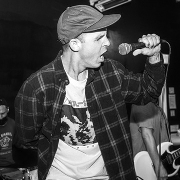 Singer Tony Bertolino of Bent Blue singing with the crowd at a live show at The Midnight Hour, San Fernando Valley.