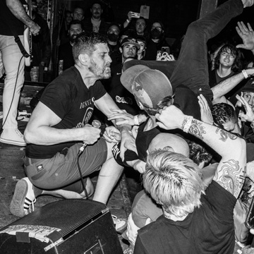Singer Dan Yemin of Paint it Black singing with the crowd at a live show at Chain Reaction, Anaheim.